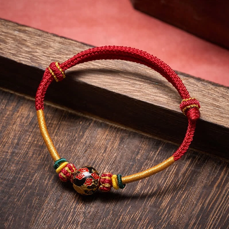 Adjustable sliding knots on red-gold woven rope dragon bracelet