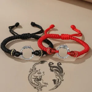 Dragon phoenix couple lucky bracelets flat lay - red and black woven cord with silver peace buckles