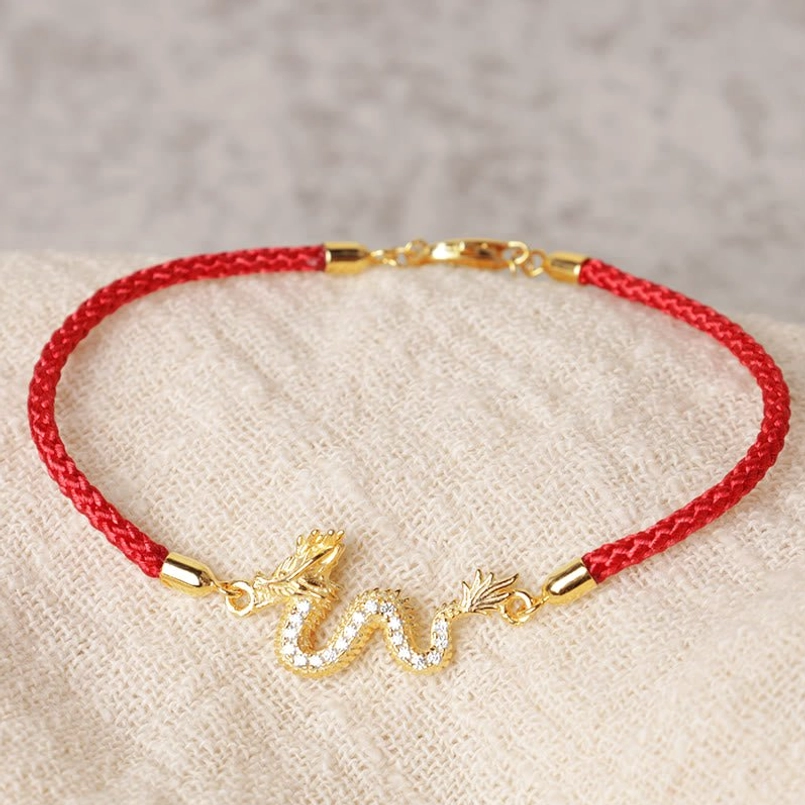 Handmade Dragon Red String Bracelet circular view with gem-inlaid gold dragon