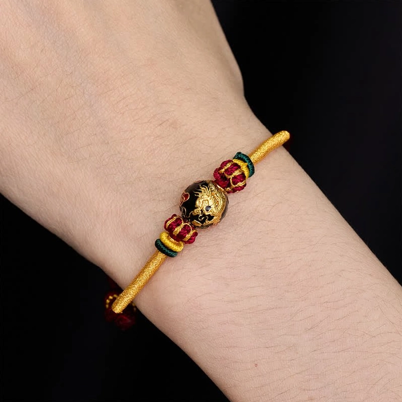 Slim woven red string dragon bead bracelet with matching copper decorations