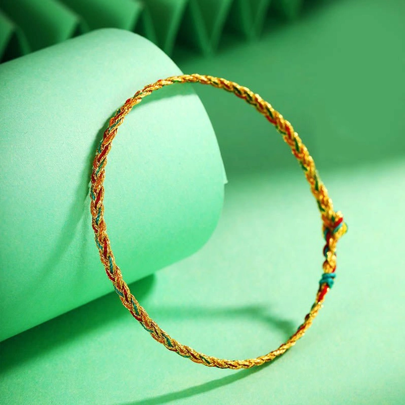 Dragon scale braided bracelet displayed on green cylindrical prop showing adjustable knot design and loop shape
