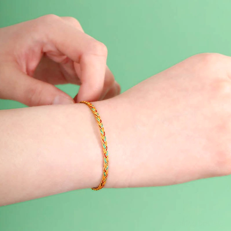 Handmade multicolor dragon scale braided bracelet worn on wrist showing comfortable slim fit