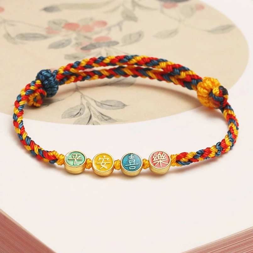 Handmade Dunhuang peace and joy bracelet featuring tri-color woven rope with enamel character pendants