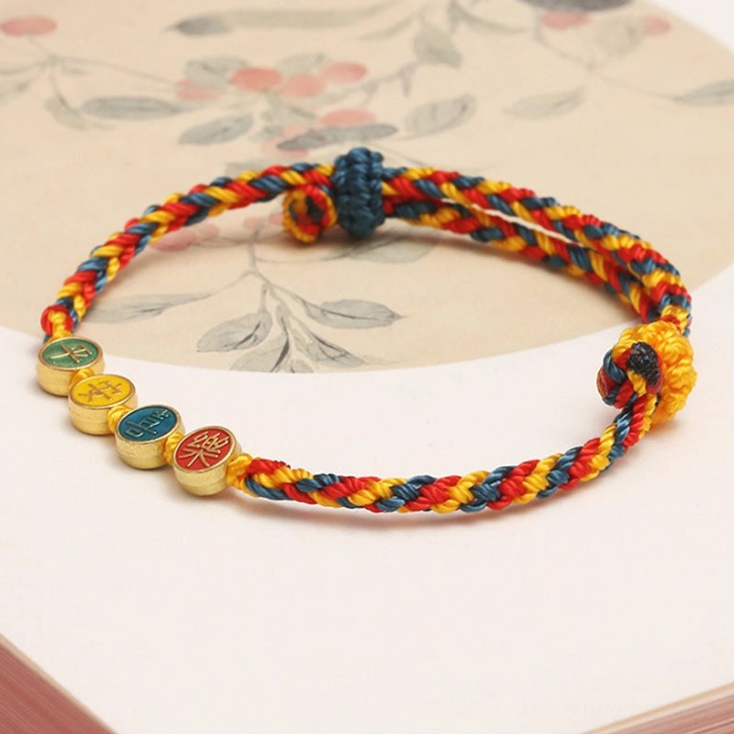 Dunhuang braided protection bracelet side view showing woven cord and toggle knot closure