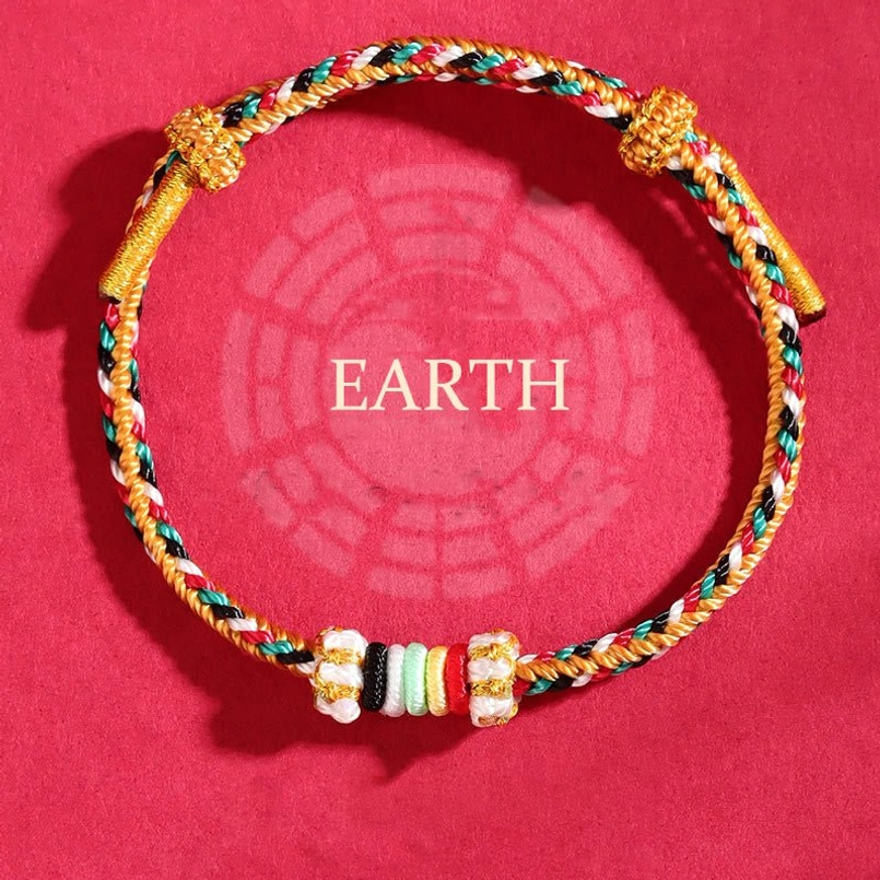 Earth element woven bracelet with multicolor braided rope and colorful spacer beads on red bagua pattern background