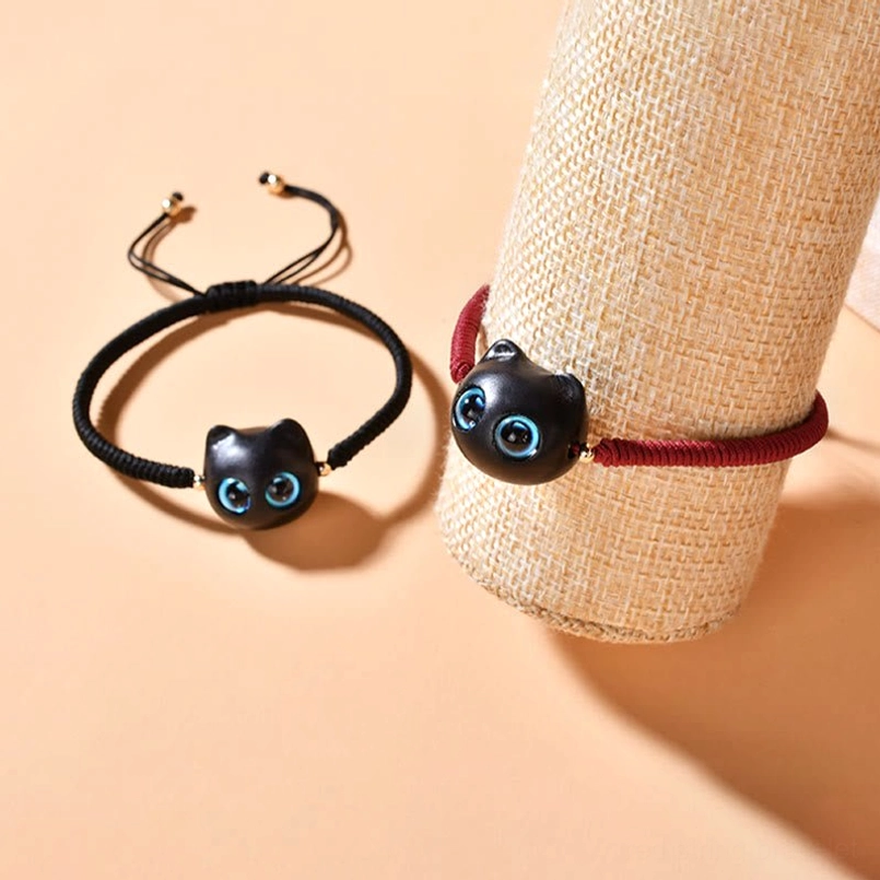 Ebony wood cat bracelet with traditional King Kong knot blessing design