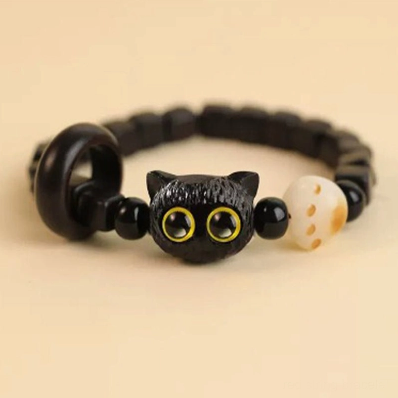 Ebony cat head red string bracelet with wooden toggle clasp full view