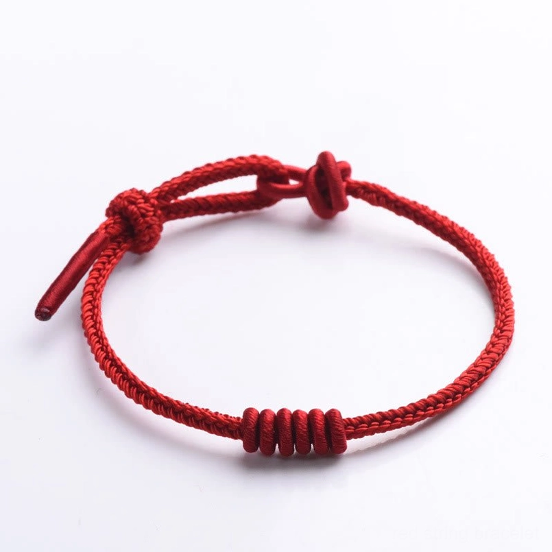 Eight stranded red string bracelet casual lifestyle shot
