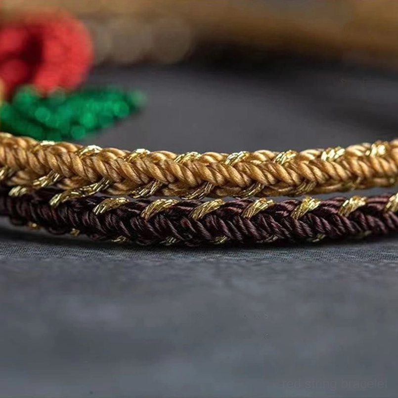 Side view of handmade braided cord peace knot bracelet showing two-tone woven texture detail