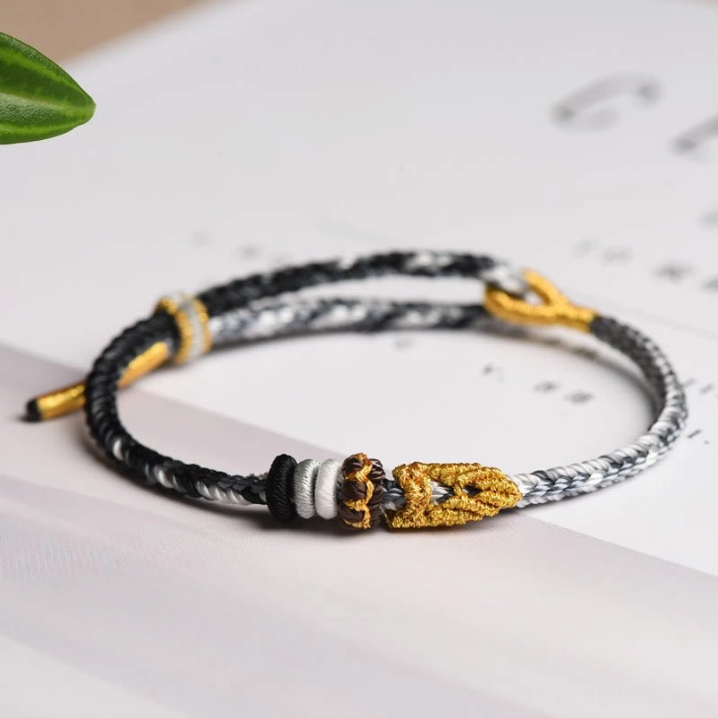 Black eight thread peace knot bracelet offering spiritual protection and grounding energy