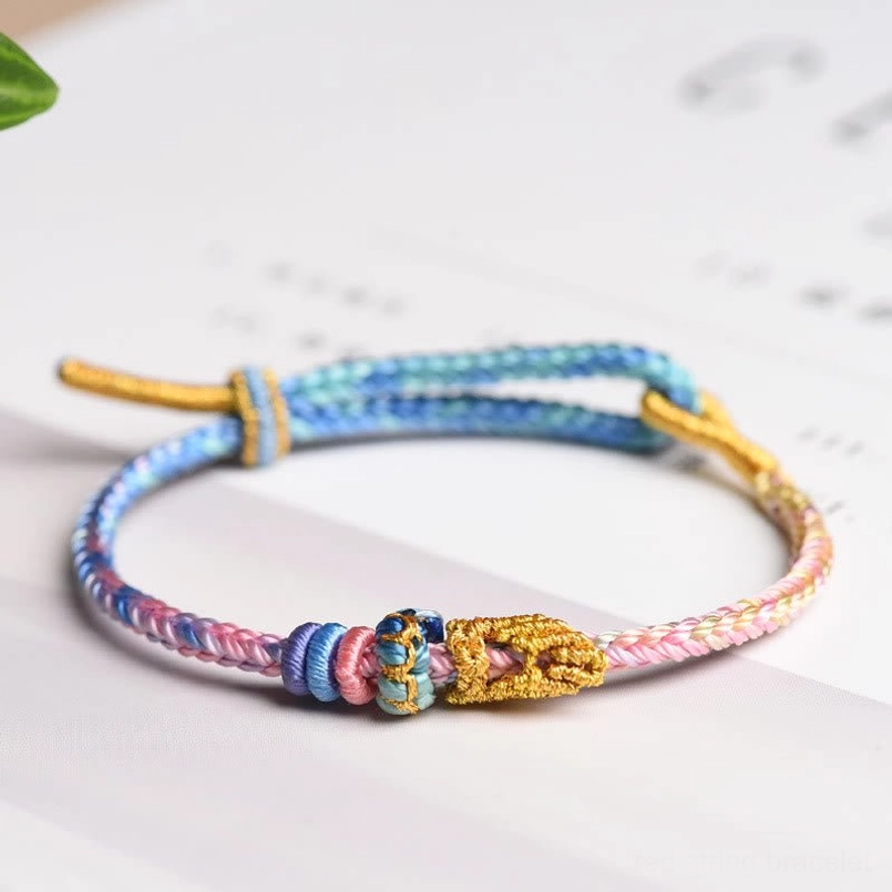 Blue and beige eight thread peace knot bracelet combining wisdom and harmony colors