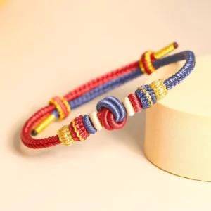 Eight thread peace knot bracelet in red, blue, gold and white woven design with adjustable knot