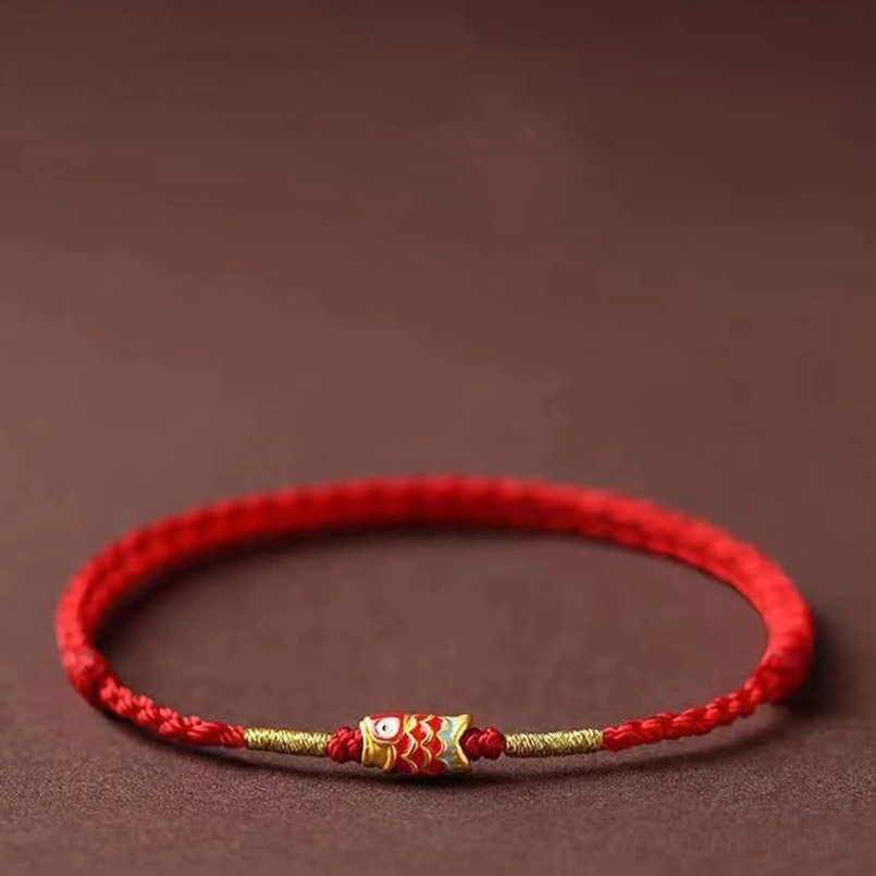 Detailed View of Enamel Koi Charm on Braided Red String Bracelet