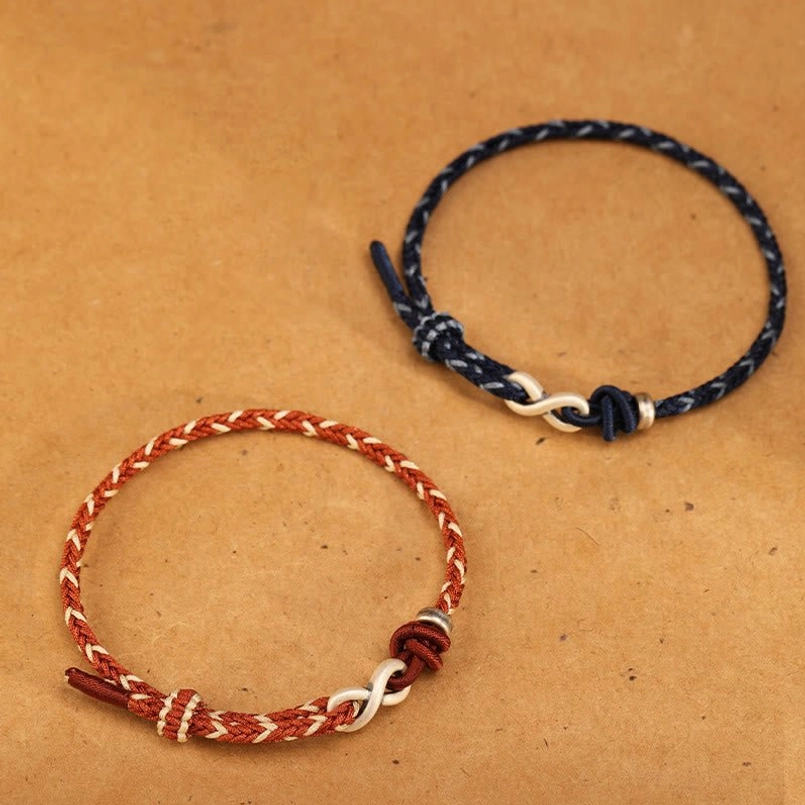 Dark blue and red-brown endless knot sterling silver bracelets side by side comparison