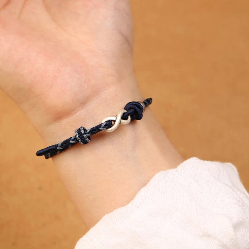 Sterling silver endless knot infinity symbol bracelet with protective red string tradition