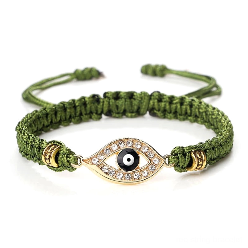 Evil eye red string bracelet paired styling with multiple bracelets layering