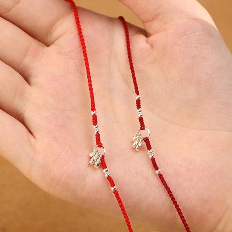 Red string fate bracelet showing traditional craftsmanship and premium sterling silver materials