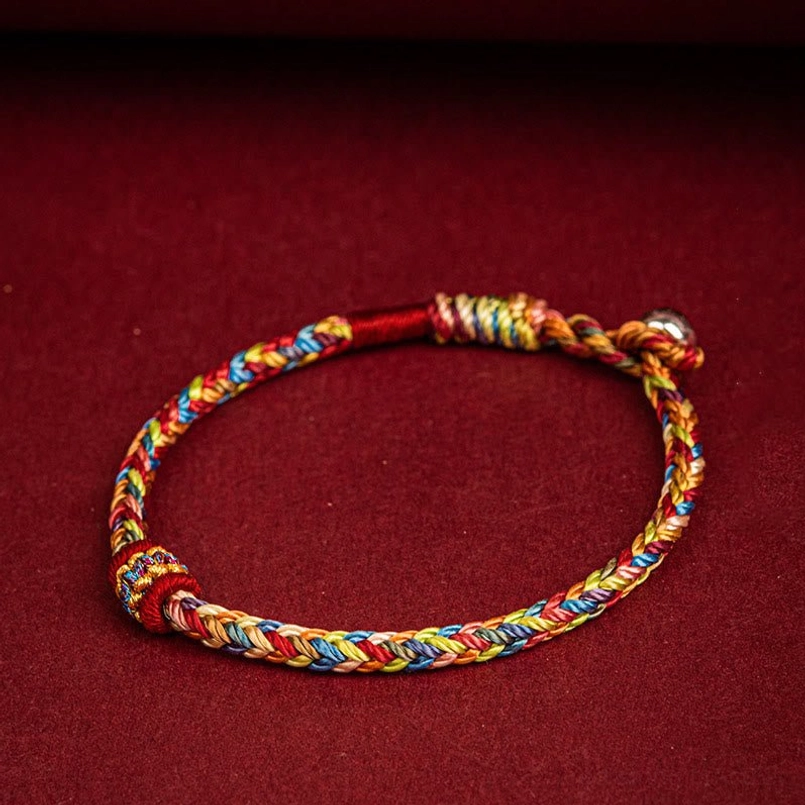 Dragon Boat Festival multicolor red string bracelet with tied closure knot detail flat lay view