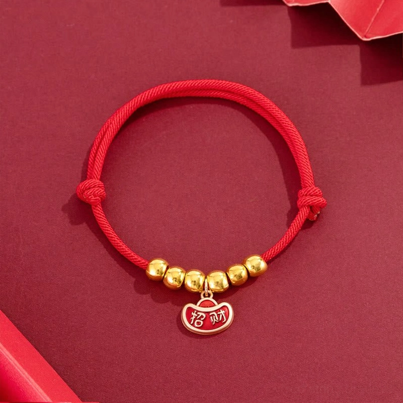 Festive red string pet collar with yuanbao enamel pendant, flat lay display with adjustable knot detail