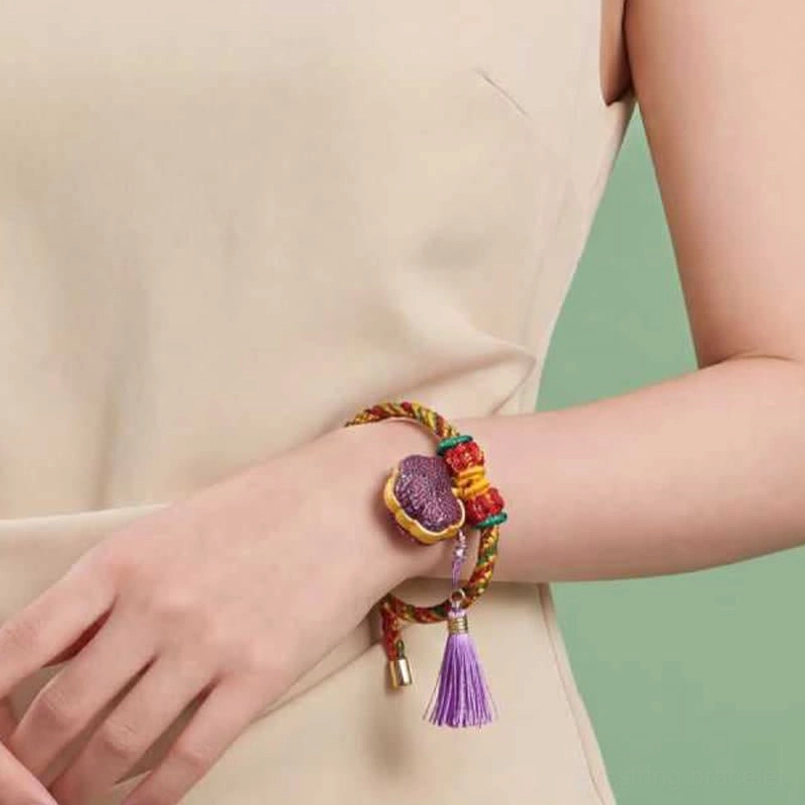 Handcrafted five-color woven bracelet featuring gourd charm for protection and prosperity