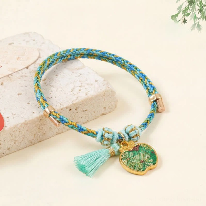 Song Brocade red string bracelet with blue yellow woven cord turquoise tassel and apple-shaped enamel peace pendant