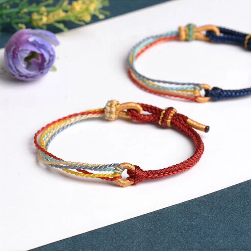 Two five color handmade protection bracelets with flower decor styling