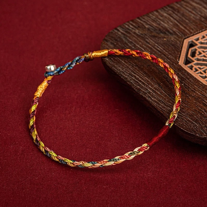 Multicolor braided luck bracelet with silver metal buckle - oblique angle product view