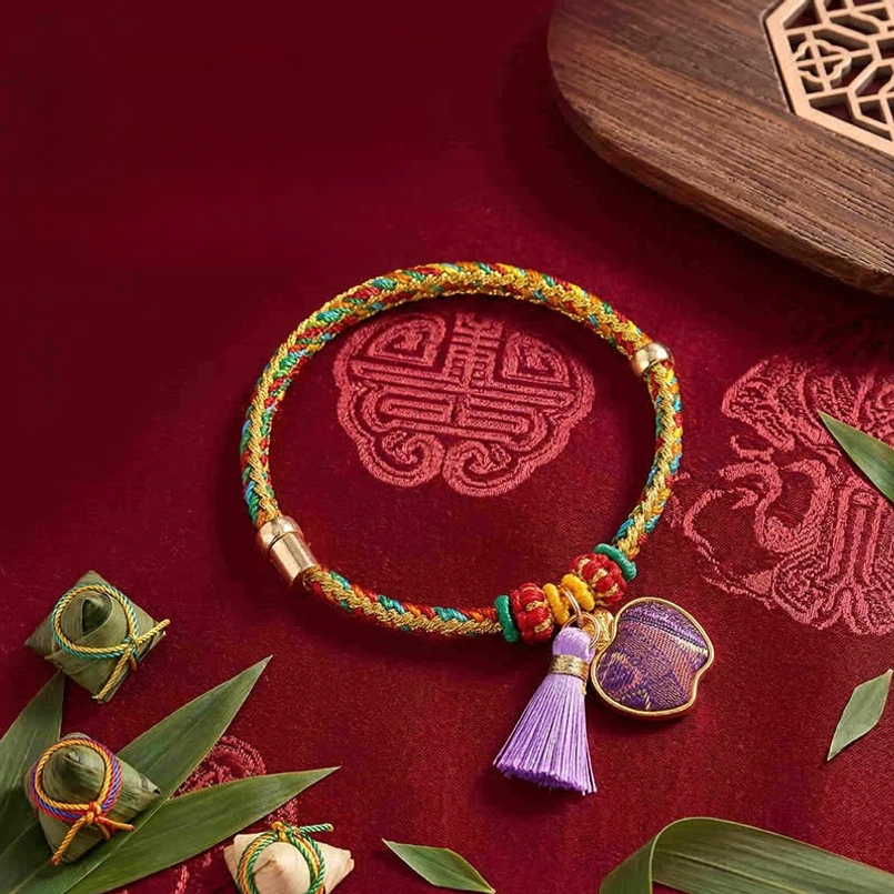 Five-color lucky bracelet with apple charm variant featuring handwoven Song Brocade cord