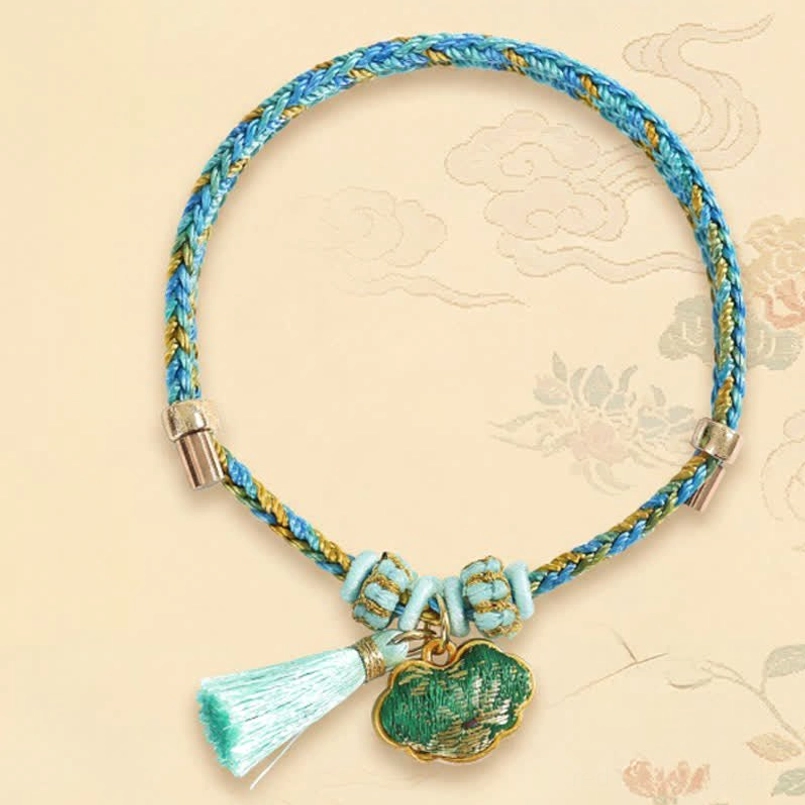 Prosperity bracelet five-color Song Brocade cord with money bag charm pendant hand-woven protection amulet close-up detail