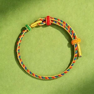 Five color Tibetan red string bracelet with adjustable toggle clasp - flat lay view