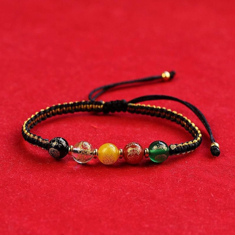 Handmade Five Directions agate luck bracelet with adjustable pull knot on red velvet background