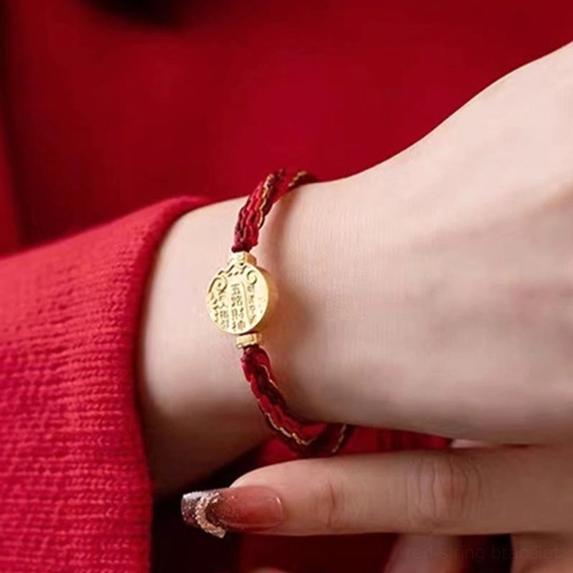 Five directions blessing bracelet gift presentation showing premium handmade red string with gold accents