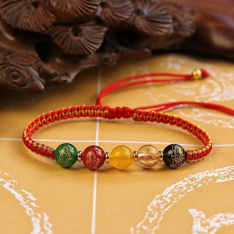 Red cord Five Directions wealth protection bracelet with gold trim and matching gemstone beads