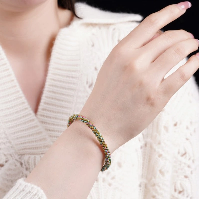 Multicolor braided five element lucky bracelet worn on slim wrist, daily wearable handcrafted jewelry