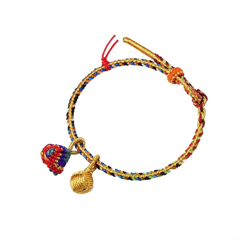 Five element colorful charm bracelet with two decorative golden ball pendants white background