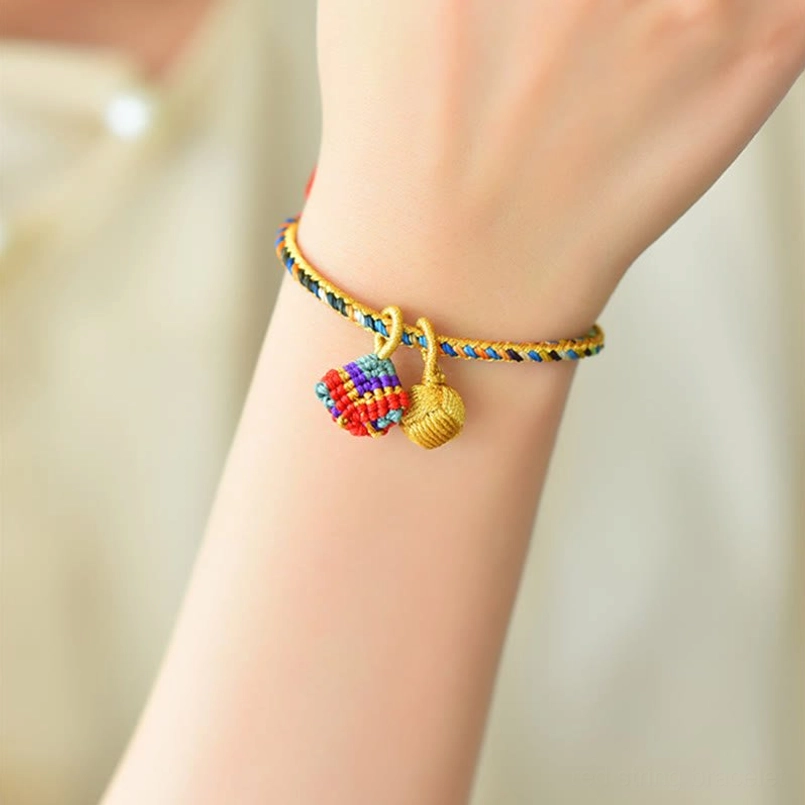 Lucky charm bracelet with five element colors worn on human wrist showing fit and charm