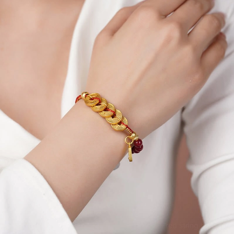 Five-emperor coins bracelet side view worn on wrist golden dark red