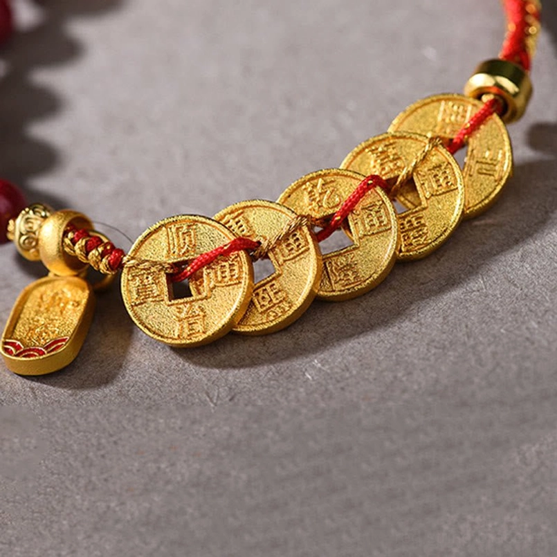 Five-emperor coins bracelet close-up ancient copper coins red string texture