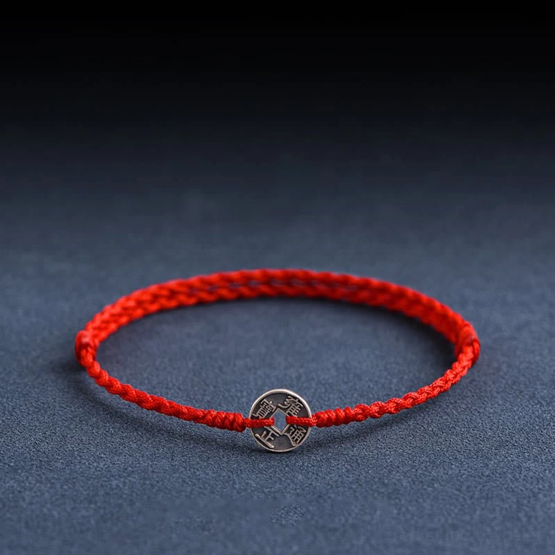 Five Emperor Coins red string bracelet front view with silver coin charm on braided red cord