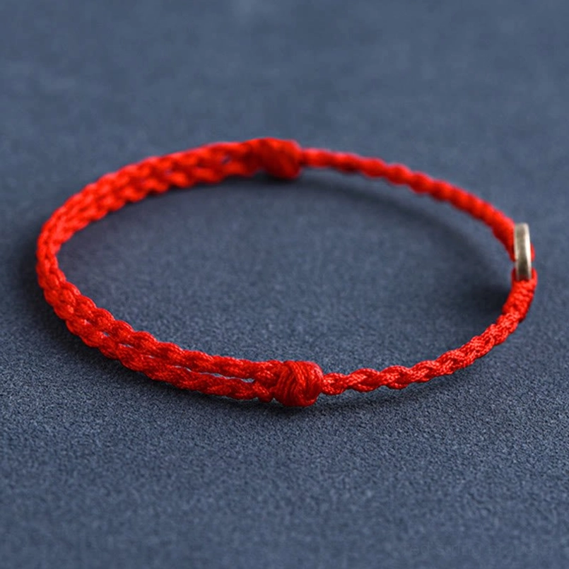 Red string bracelet front view with fixed knot and silver Emperor coin charm on cord end