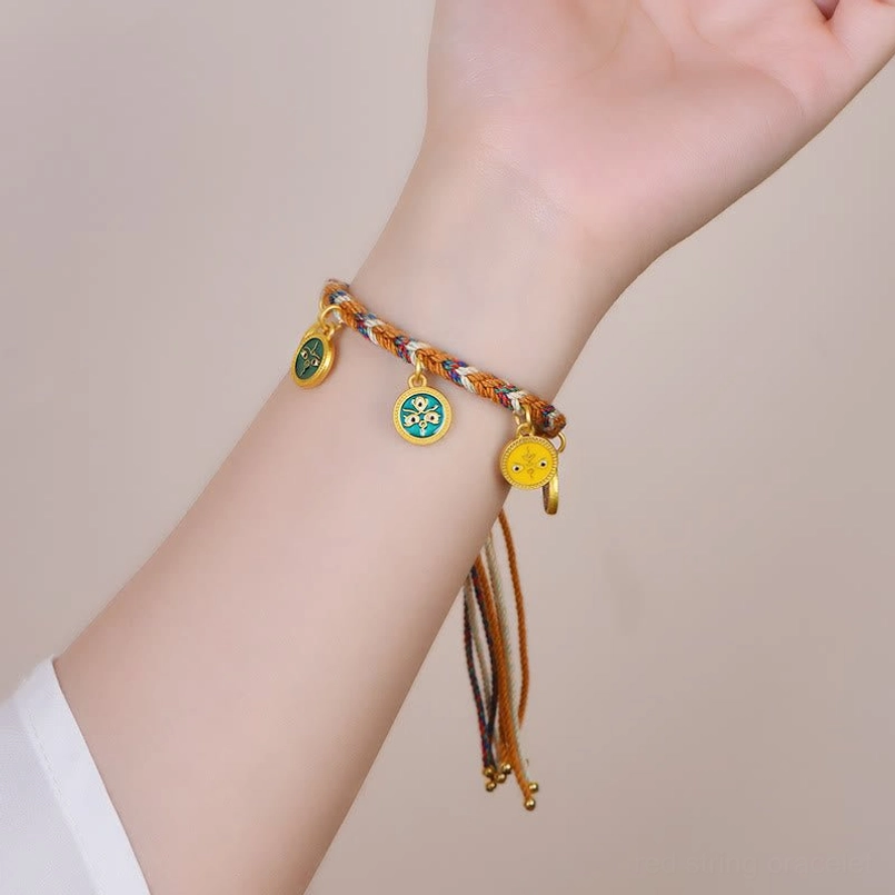 Tibetan five gods of wealth rope bracelet worn on wrist with colorful hanging charms