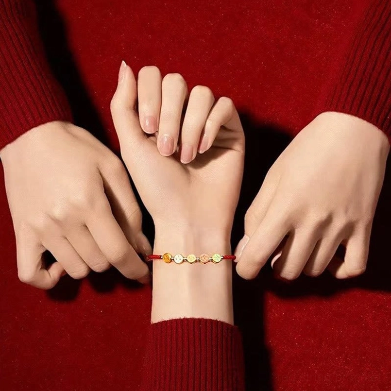 stacked five enamel charm wealth bracelet worn on wrist casual shot