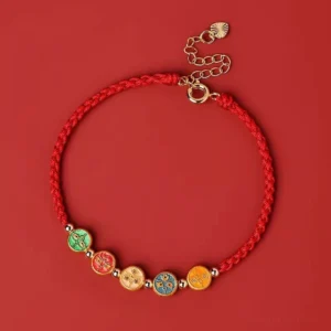 925 sterling silver five ways god of wealth red string bracelet flat lay on red background