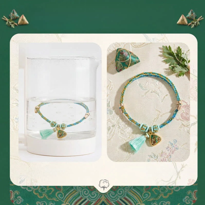 Chinese luck bracelet displayed in water cup paired with zongzi and mugwort for Dragon Boat Festival themed protective jewelry collection