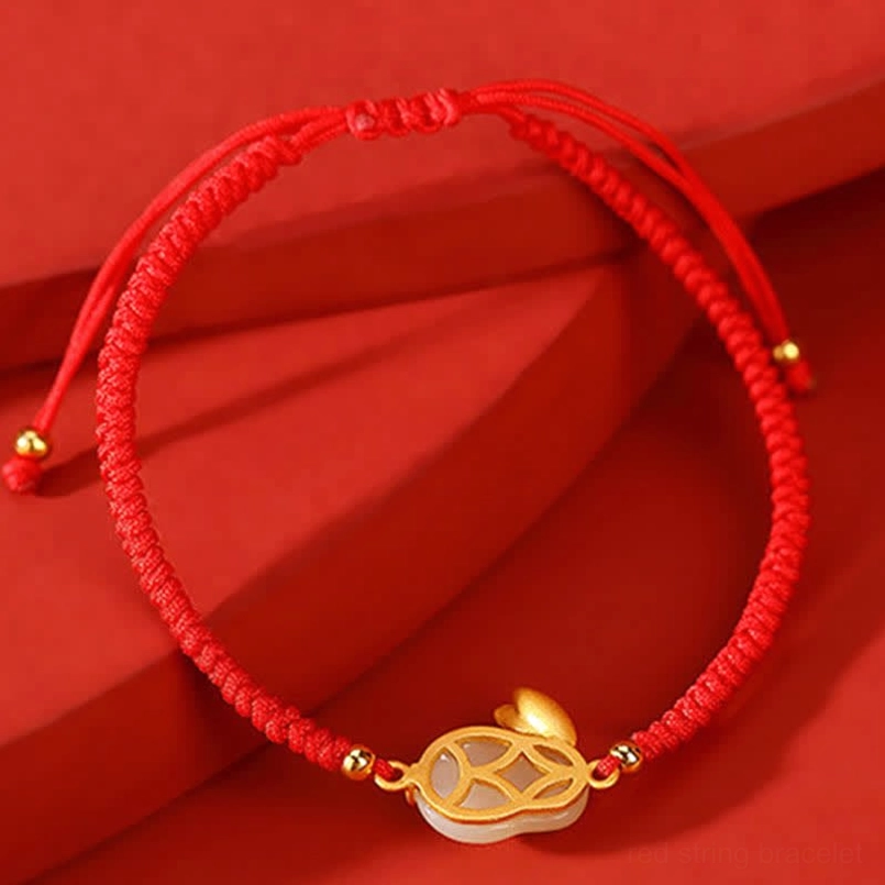 Hetian jade rabbit bracelet fortune charm with hollow gold coin accent and rabbit tail decoration