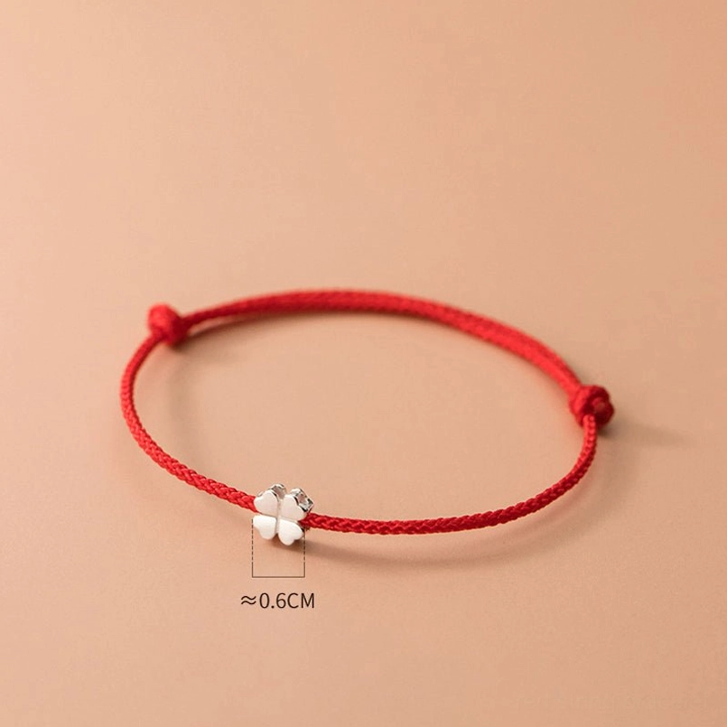six millimeter sterling silver four leaf clover pendant on red string bracelet