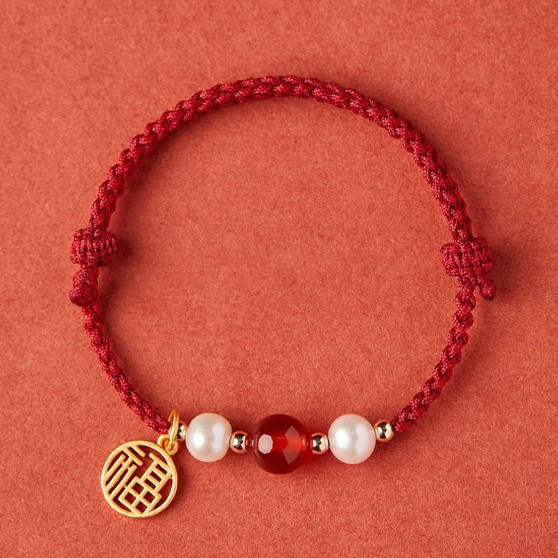 Fu Character 925 Sterling Silver hollow fortune charm with red string and pearl accents detail view