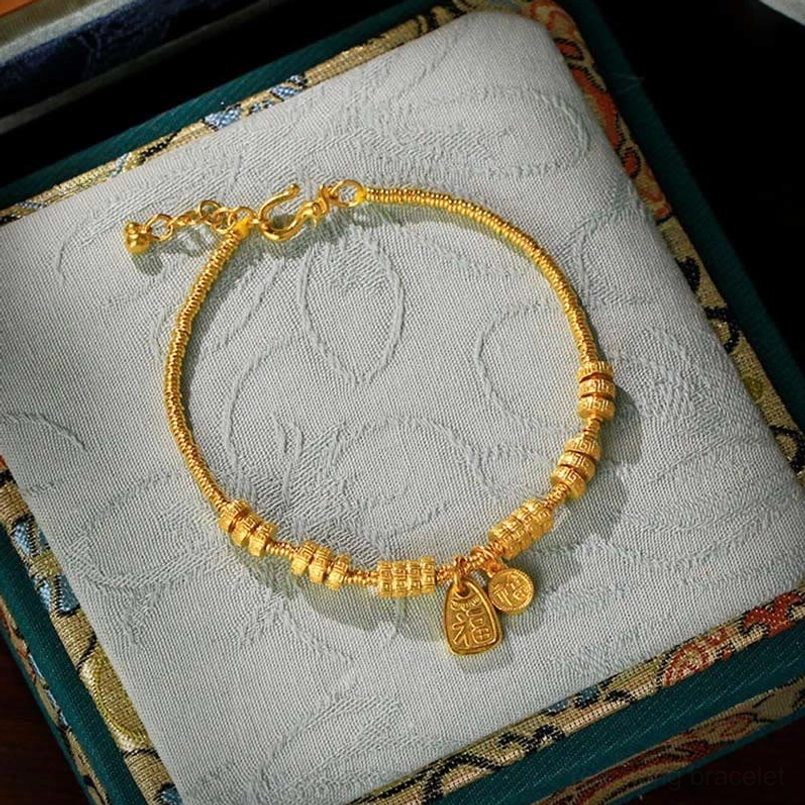 24K gold plated Fu character blessing bracelet with dual pendants in embroidered jewelry gift box