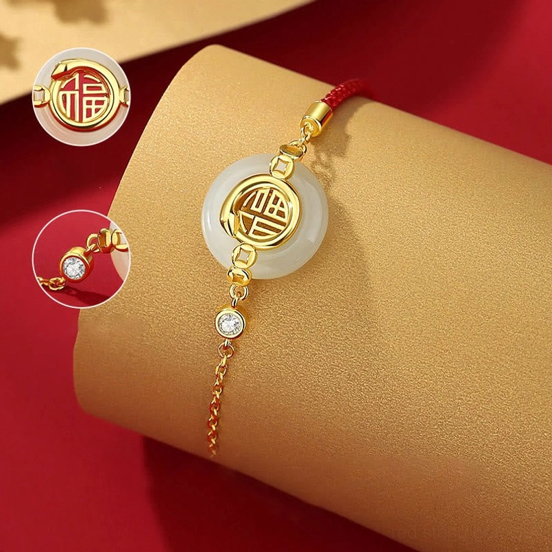 Year of Snake red string bracelet oblique view with Fu charm and zircon close up