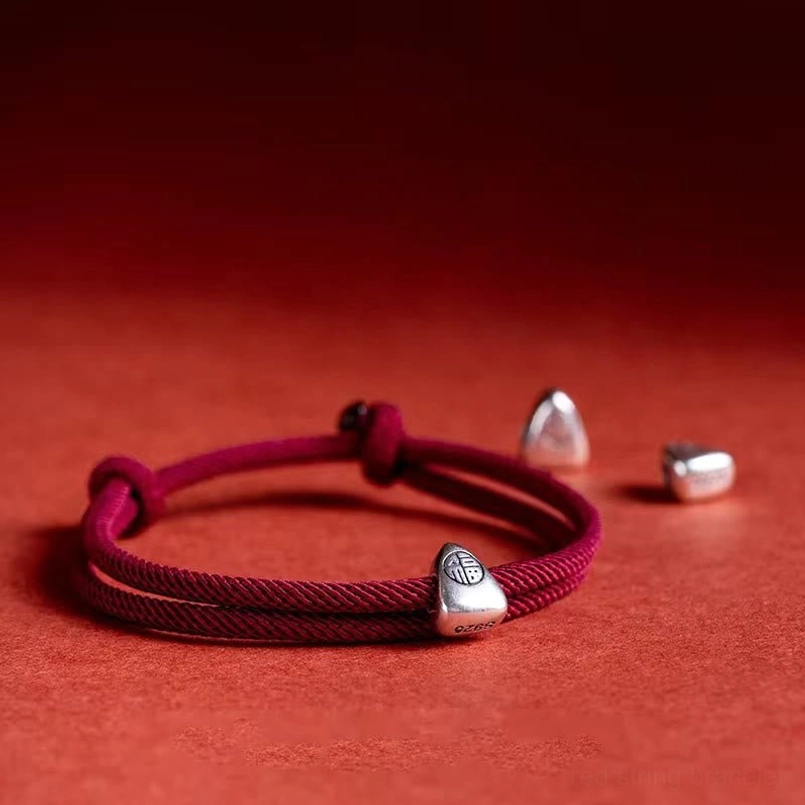 925 sterling silver fu character red string blessing bracelet flat lay with adjustable knot